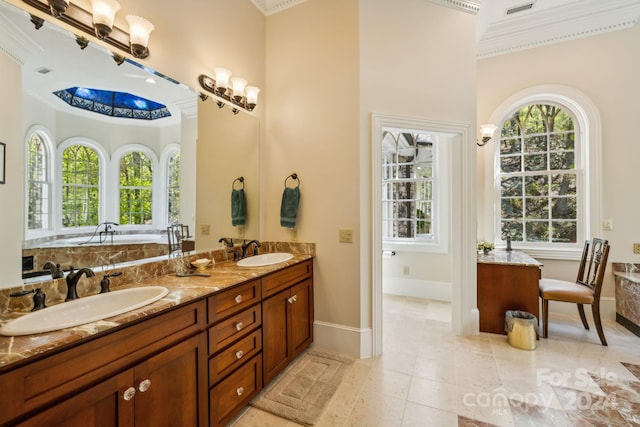 bathroom with crown molding, tile flooring, dual bowl vanity, a bathing tub, and a towering ceiling