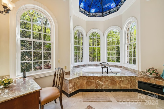 bathroom featuring tile floors, ornamental molding, and a relaxing tiled bath