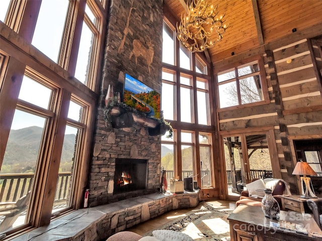 living room with high vaulted ceiling and a healthy amount of sunlight