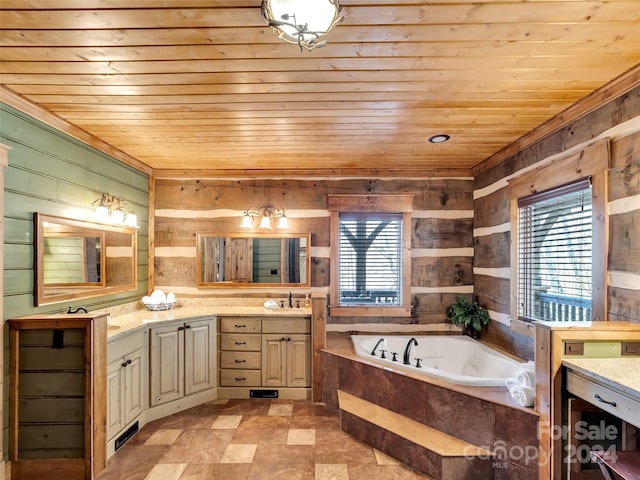 bathroom featuring tile flooring, vanity, tiled tub, wooden walls, and wooden ceiling