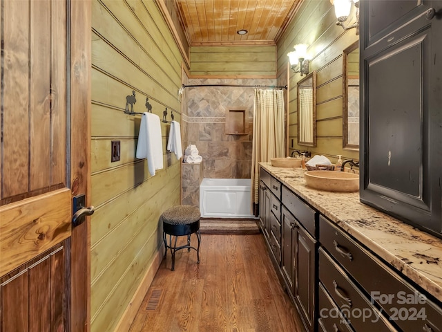 bathroom featuring crown molding, wooden ceiling, wood-type flooring, wood walls, and vanity