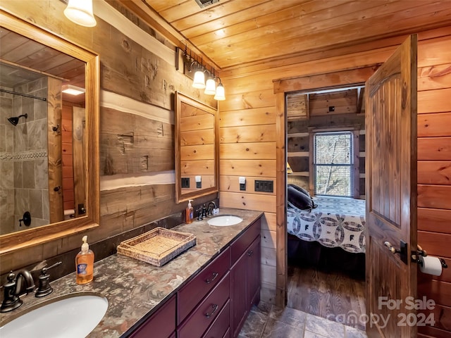 bathroom with wooden ceiling, hardwood / wood-style flooring, dual vanity, and wood walls