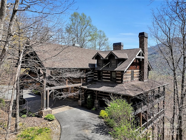 cabin featuring a carport