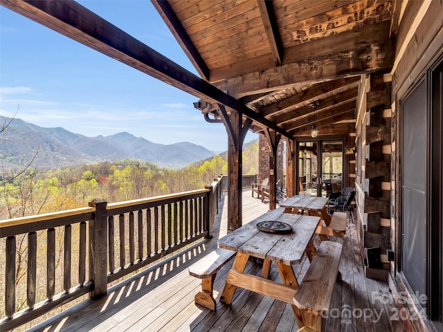 wooden terrace with a mountain view