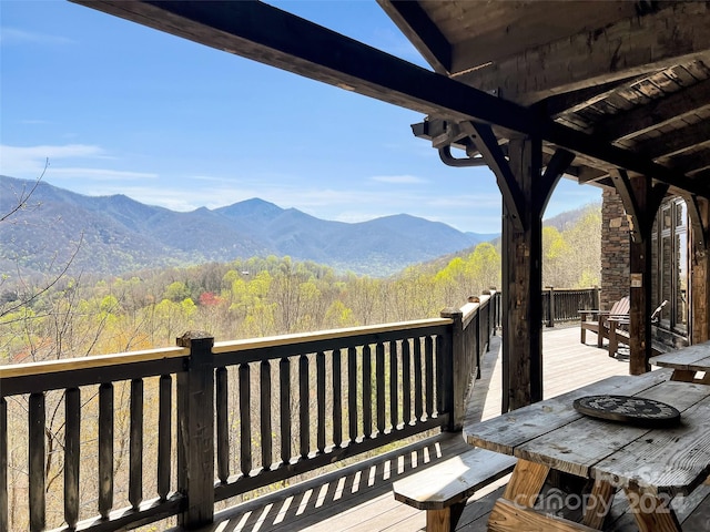 wooden terrace featuring a mountain view