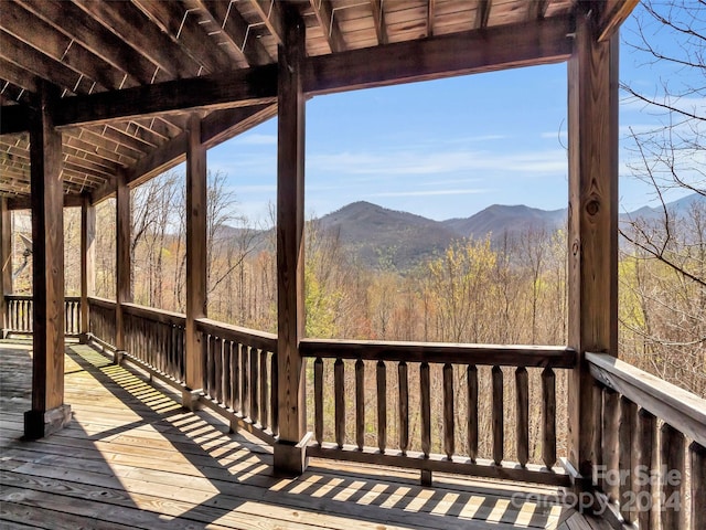 wooden terrace with a mountain view