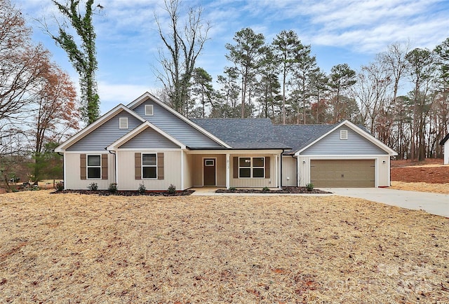 view of front of house with a front yard and a garage