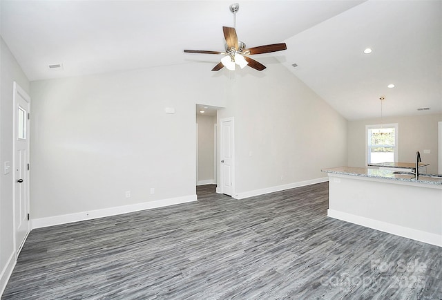 unfurnished living room with ceiling fan, high vaulted ceiling, sink, and dark hardwood / wood-style flooring