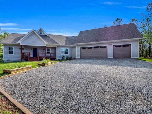 single story home with a front lawn, a garage, and a porch