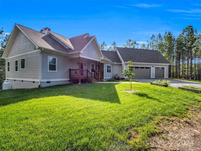 view of front of house with a front yard and a garage