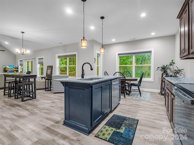 kitchen featuring light hardwood / wood-style flooring, dishwasher, hanging light fixtures, range, and sink