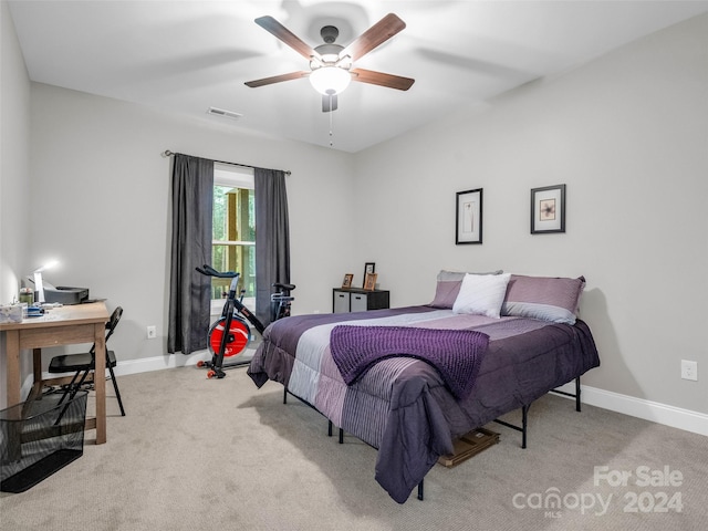 bedroom featuring light carpet and ceiling fan