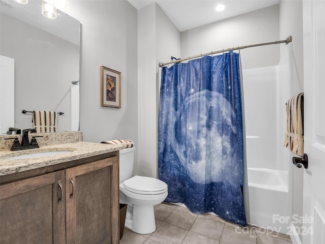 full bathroom featuring vanity, toilet, tile floors, and shower / tub combo