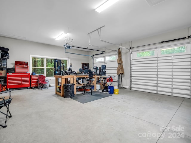 garage featuring a workshop area and a garage door opener