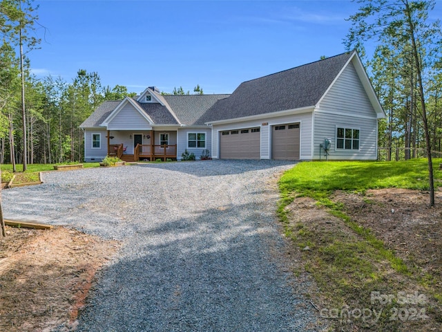 view of front of house featuring a garage and a front lawn