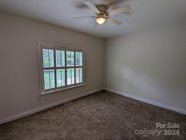 carpeted empty room with ceiling fan