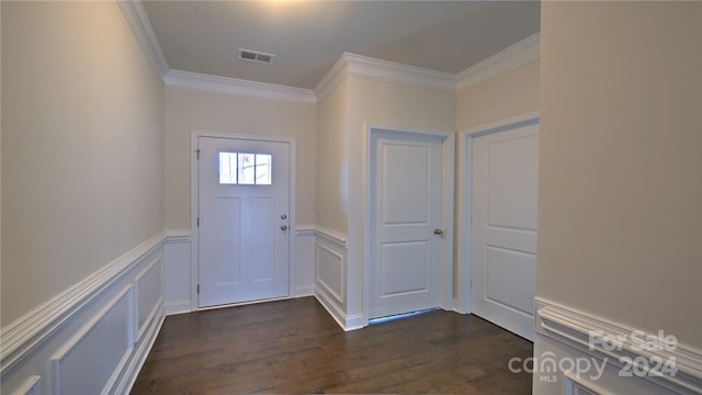 entrance foyer featuring dark wood-type flooring and ornamental molding