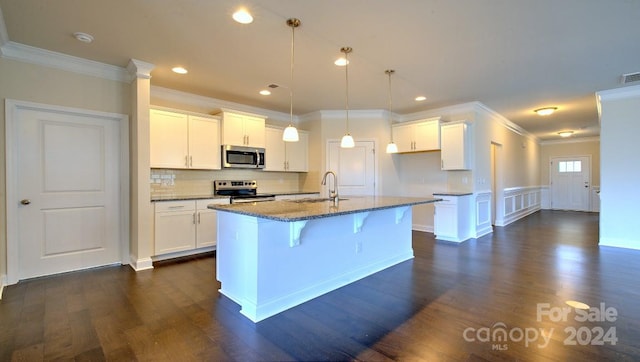 kitchen featuring white cabinets, dark wood-type flooring, and stainless steel appliances