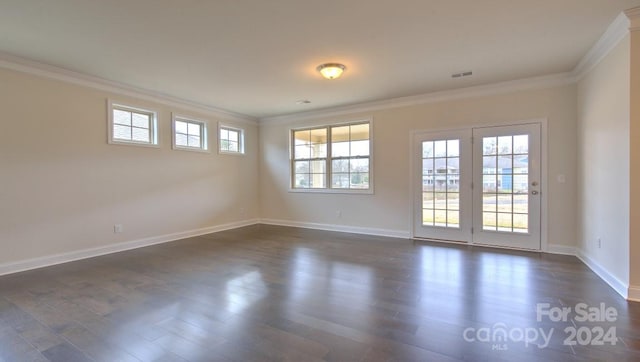 unfurnished room featuring ornamental molding and dark hardwood / wood-style flooring