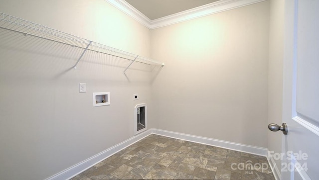 clothes washing area featuring crown molding, hookup for an electric dryer, dark tile flooring, and hookup for a washing machine