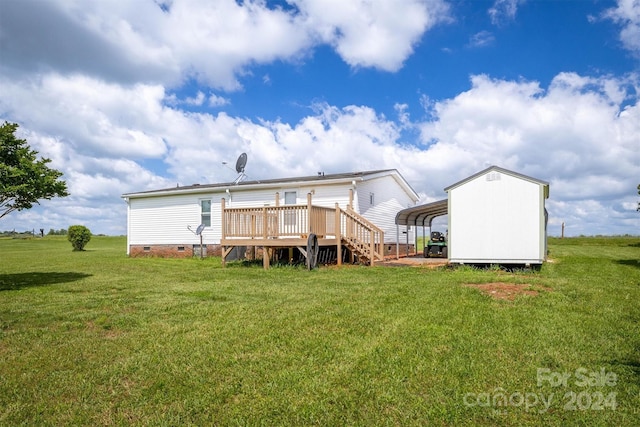 back of house featuring a lawn and a deck