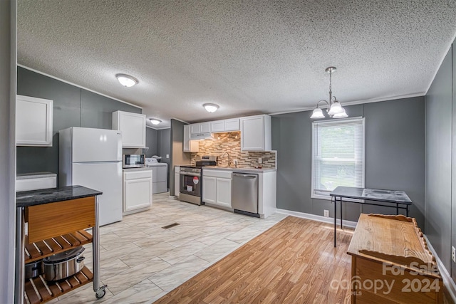 kitchen featuring white cabinetry, appliances with stainless steel finishes, pendant lighting, tasteful backsplash, and light tile flooring