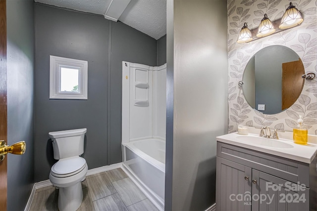 full bathroom featuring tile flooring, bathtub / shower combination, a textured ceiling, toilet, and vanity