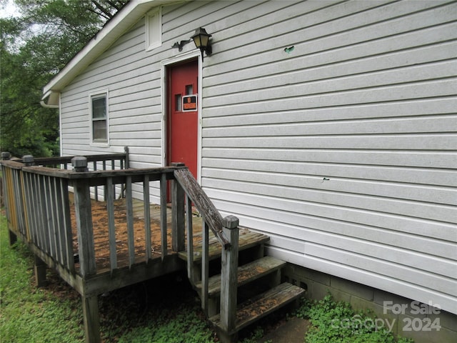 doorway to property with a deck