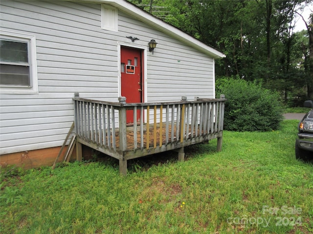 wooden deck with a yard