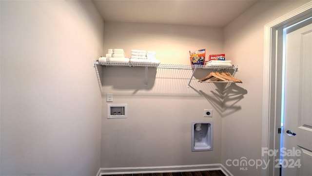 laundry room with electric dryer hookup, dark wood-type flooring, and hookup for a washing machine