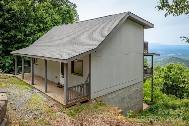 view of home's exterior with a mountain view