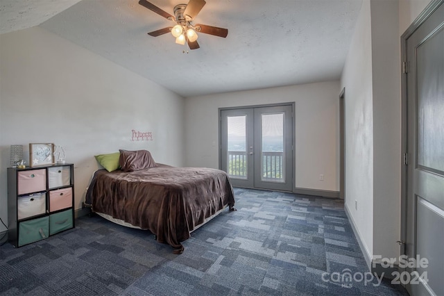 carpeted bedroom featuring a textured ceiling, access to exterior, french doors, ceiling fan, and lofted ceiling