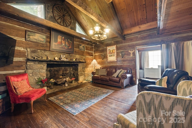 living room featuring beam ceiling, an inviting chandelier, wooden ceiling, dark hardwood / wood-style floors, and a stone fireplace