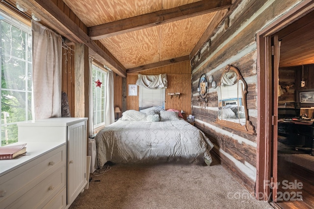 bedroom featuring carpet, vaulted ceiling with beams, wood walls, and wooden ceiling