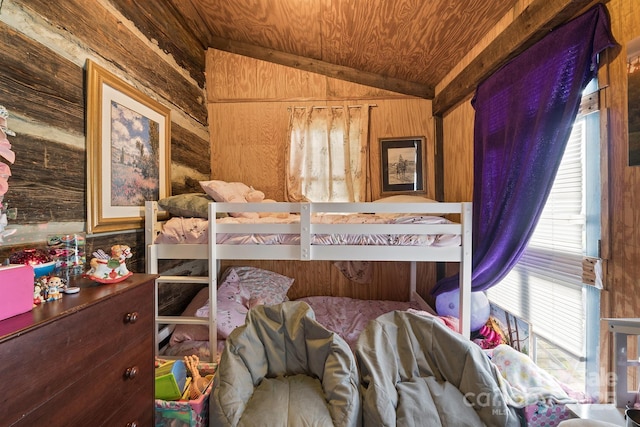 bedroom with multiple windows, wood walls, wood ceiling, and lofted ceiling