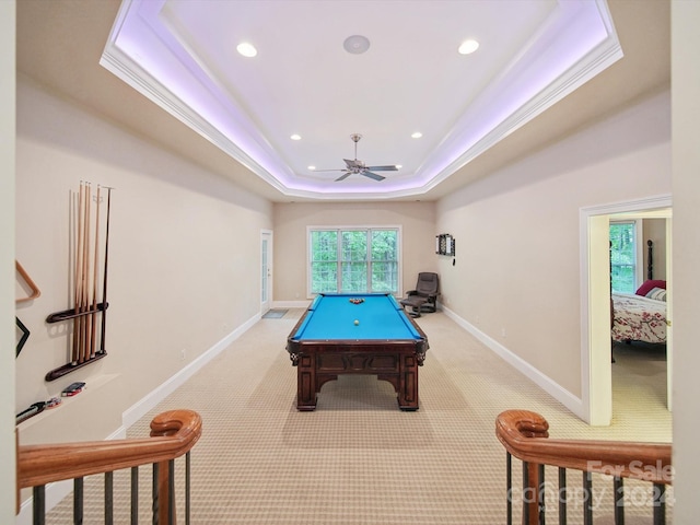 rec room with light carpet, a raised ceiling, ceiling fan, and pool table