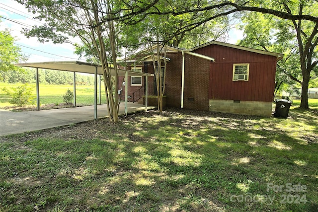 exterior space featuring a carport