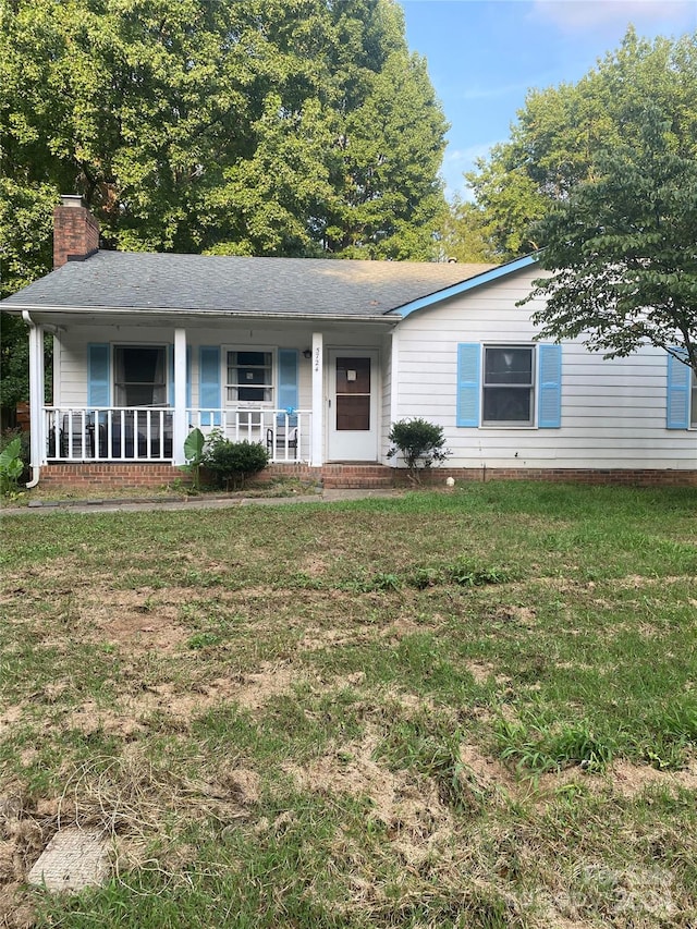 single story home with a front lawn and a porch