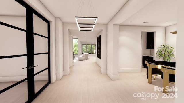 corridor featuring light hardwood / wood-style floors