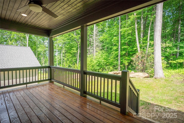 wooden terrace with a yard and ceiling fan