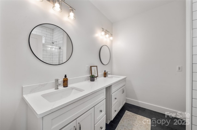 bathroom with tile patterned floors, vanity, and walk in shower