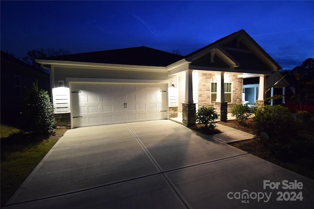 view of front of property featuring a garage