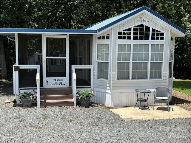 view of front of house with a sunroom