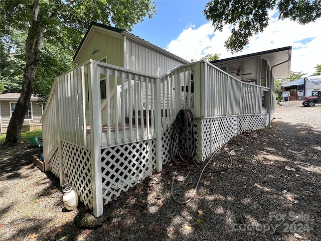 view of property exterior with a deck