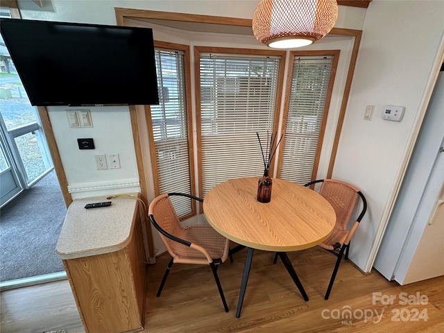 dining space with light wood-type flooring