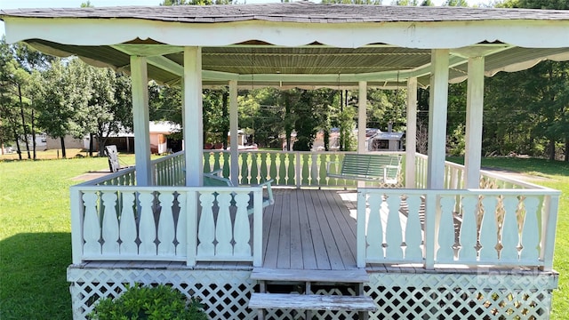 wooden deck with a lawn