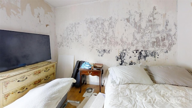 bedroom featuring hardwood / wood-style floors