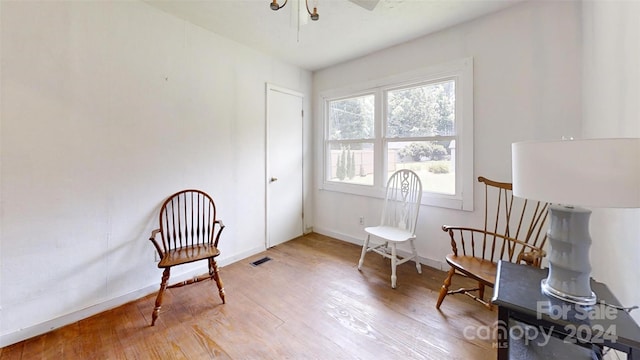 living area featuring hardwood / wood-style floors