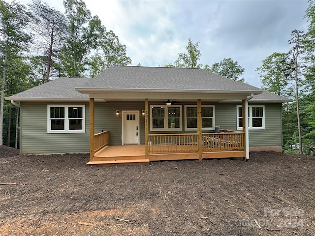 view of front of home featuring ceiling fan and a wooden deck