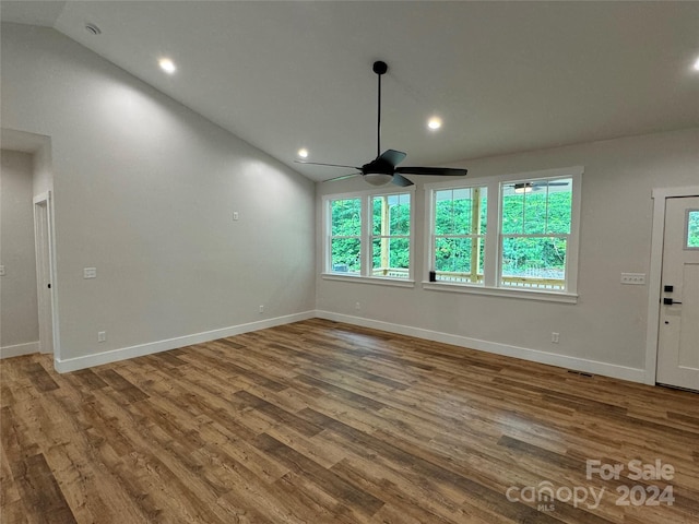 unfurnished living room featuring ceiling fan, lofted ceiling, and hardwood / wood-style flooring